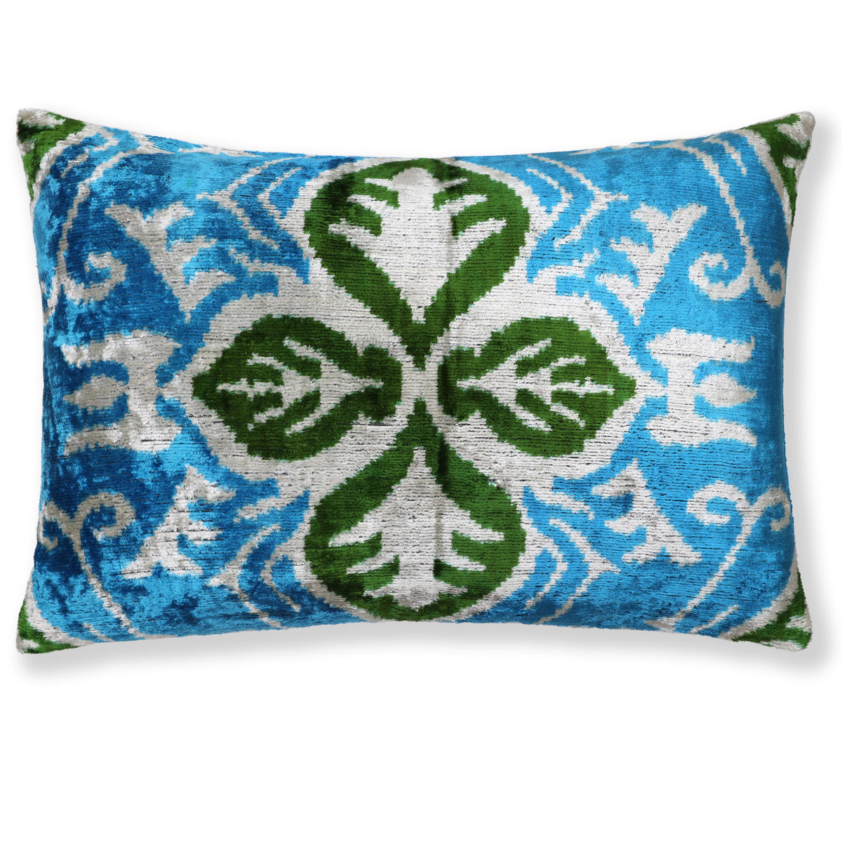 Cerulean teal lumbar pillow with soft white and bright olive green ikat clover leaf medallion