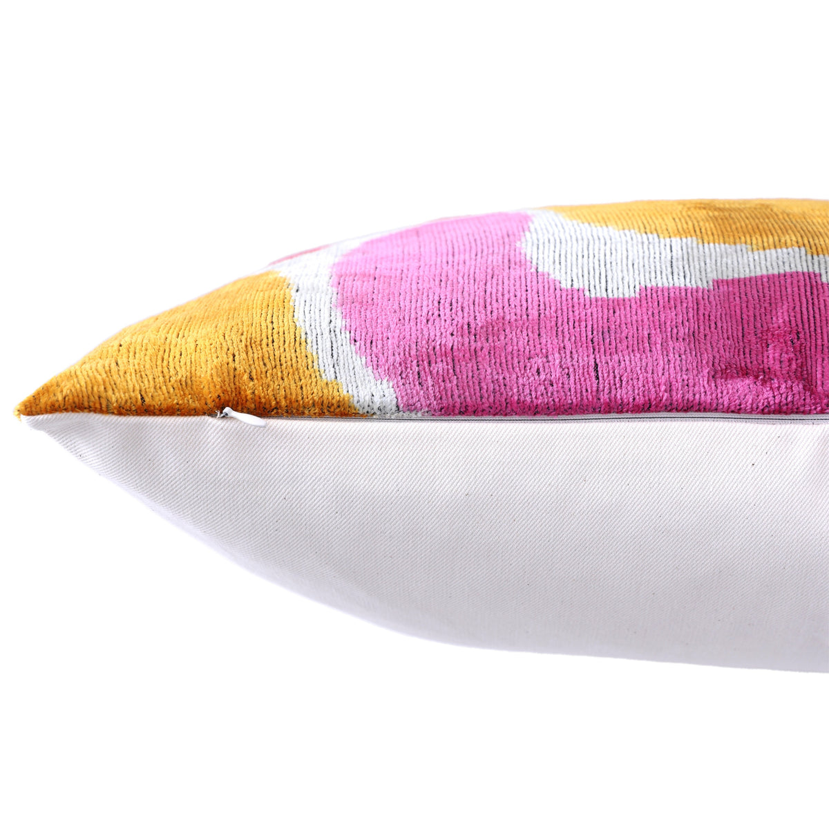 Bottom seam of abstract ikat lumbar pillow showing hidden zipper closure