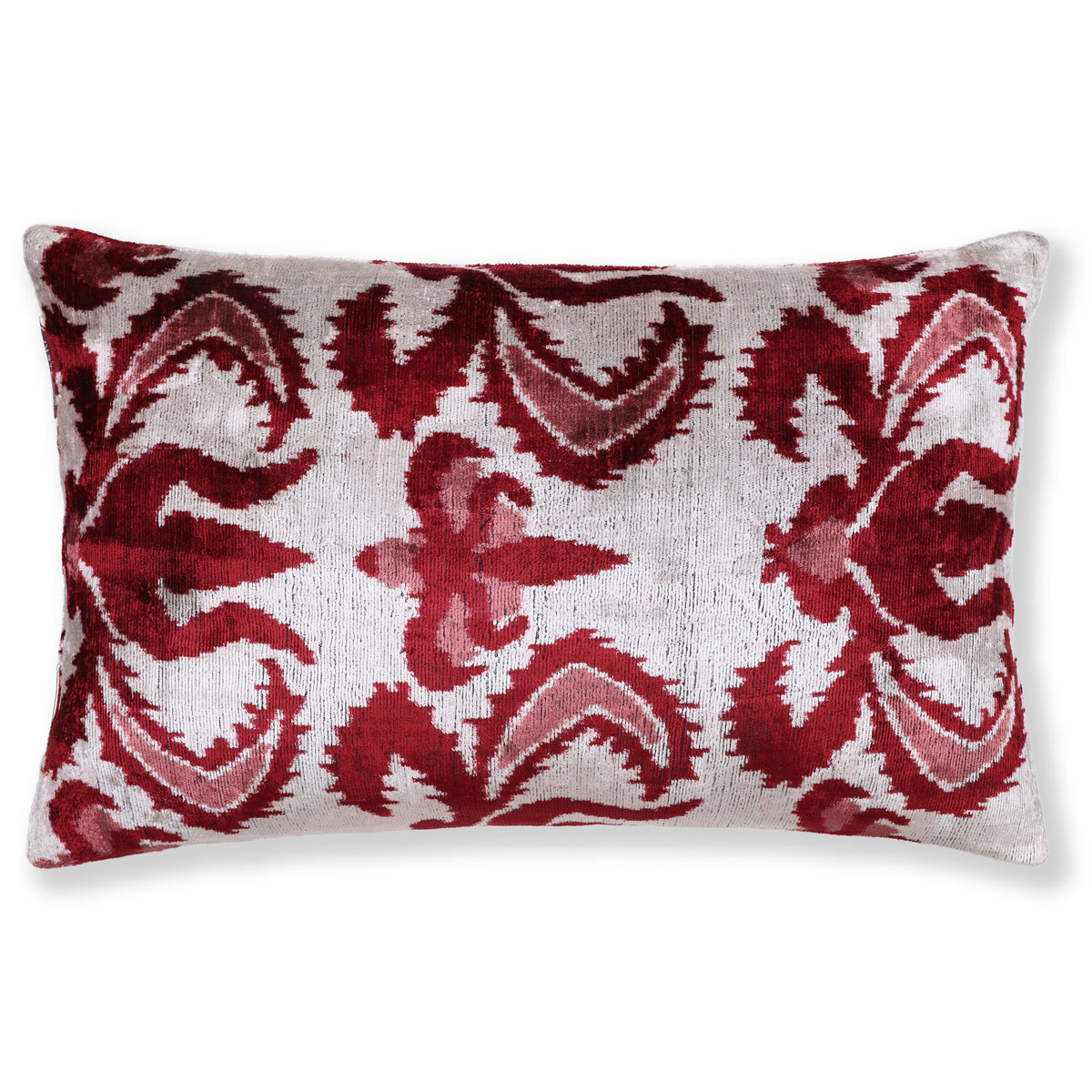 Silvery off-white lumbar pillow with deep crimson red and muted rose pink ikat floral medallion
