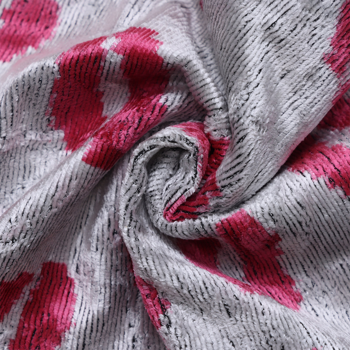 Close fabric detail showing silver gray and fuchsia pink ribbed velvet texture