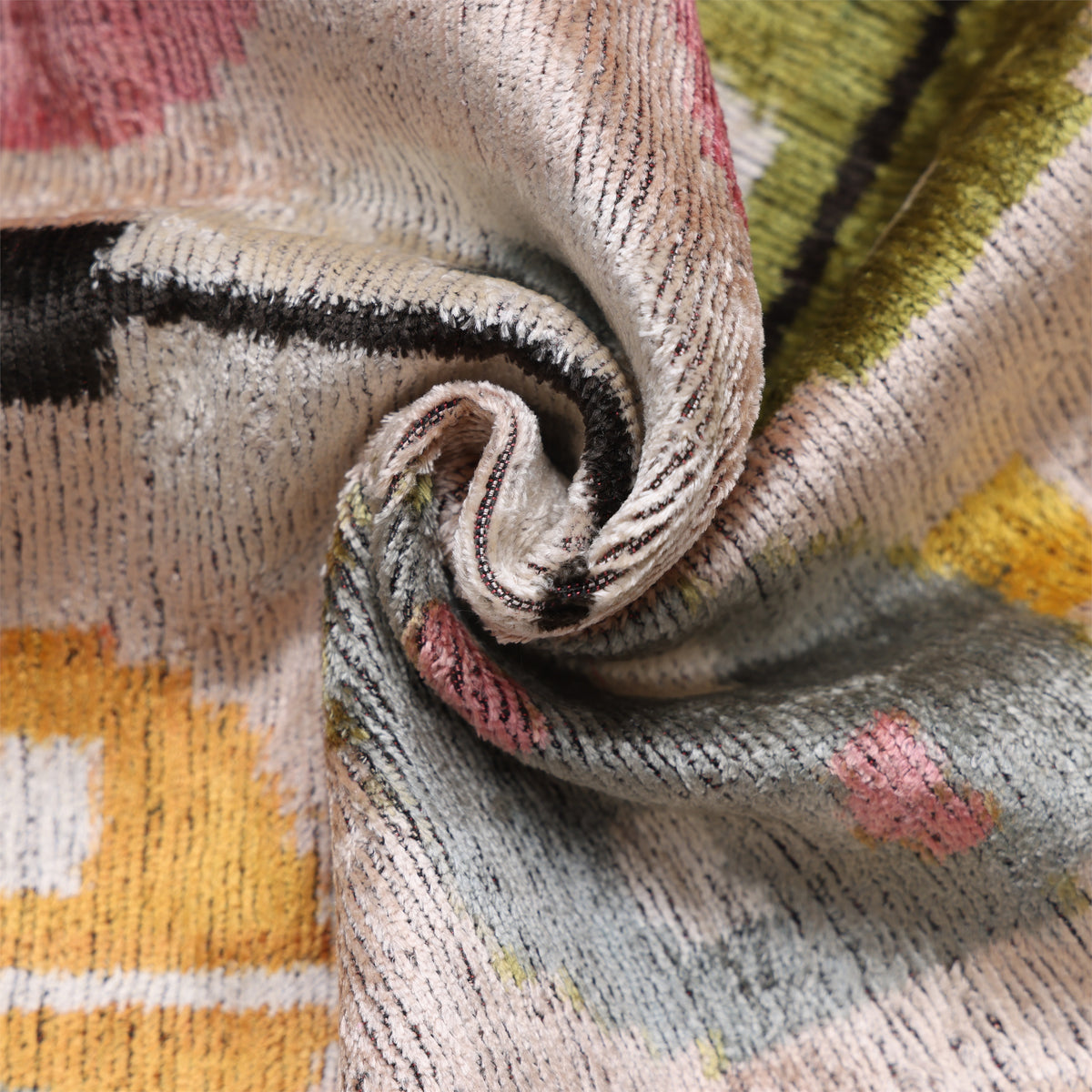 Close view of pale blush beige silk velvet pile with canary yellow and dusty rose pink pattern