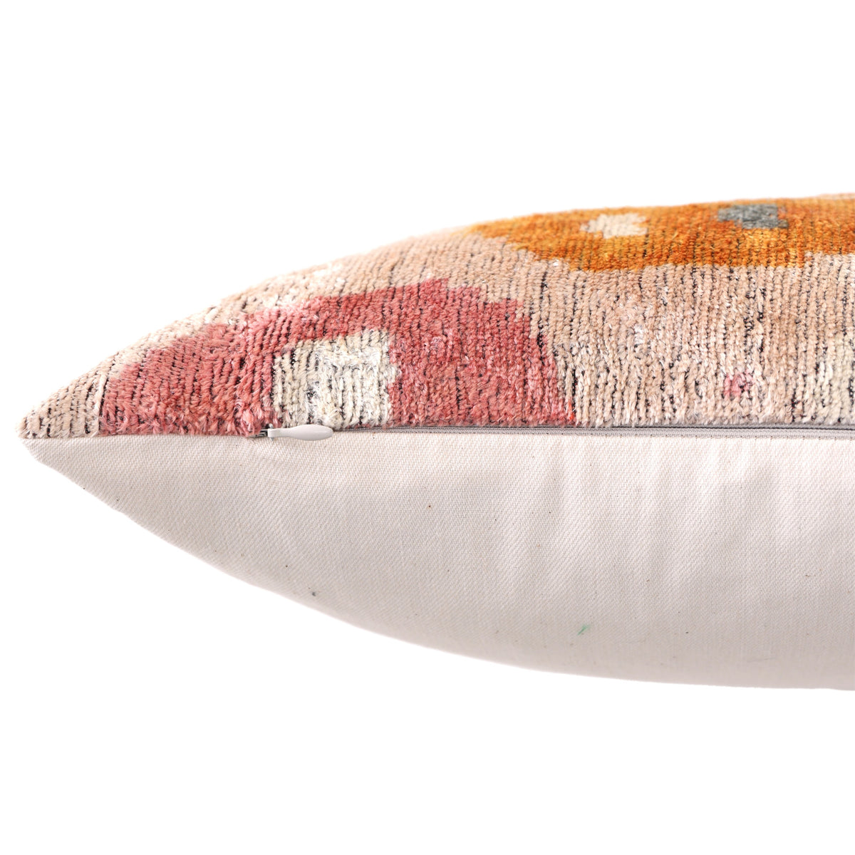 Hidden zipper along the edge of a multicolor geometric silk velvet lumbar pillow