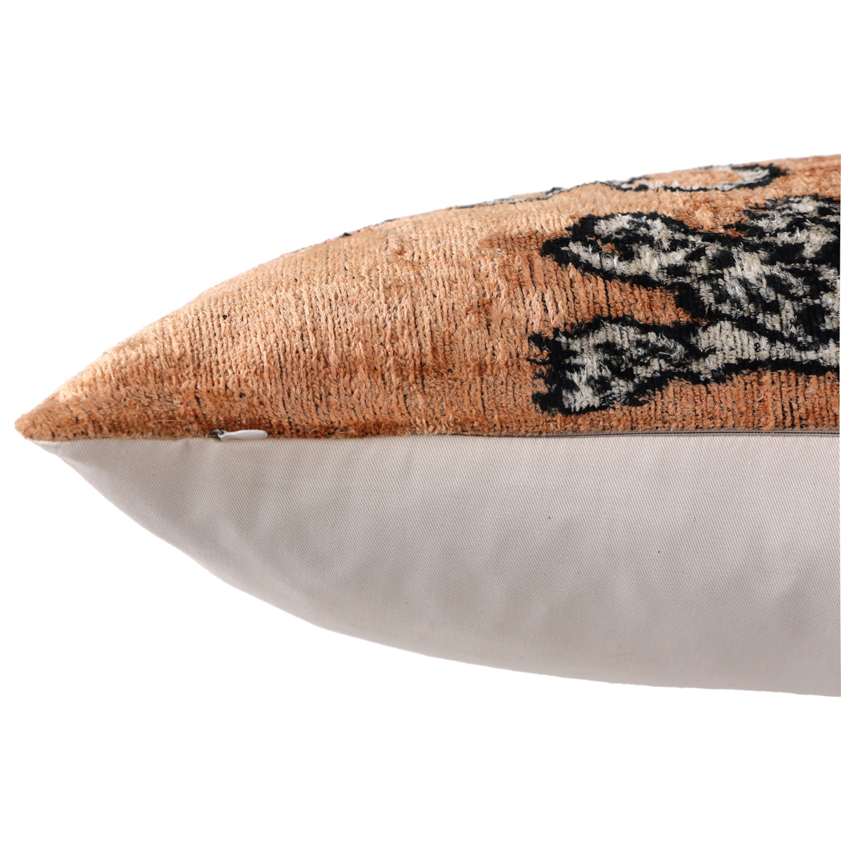 Close-up of hidden zipper along the bottom seam of camel tiger pillow