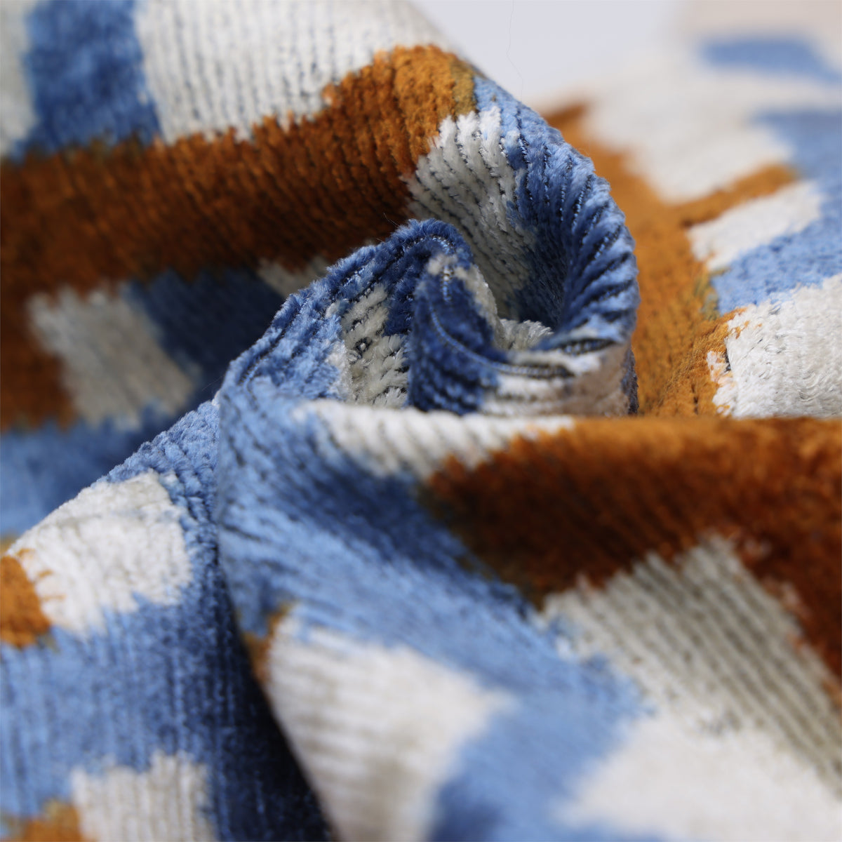 Close-up of pale ivory silk velvet with visible folded ribbed pile