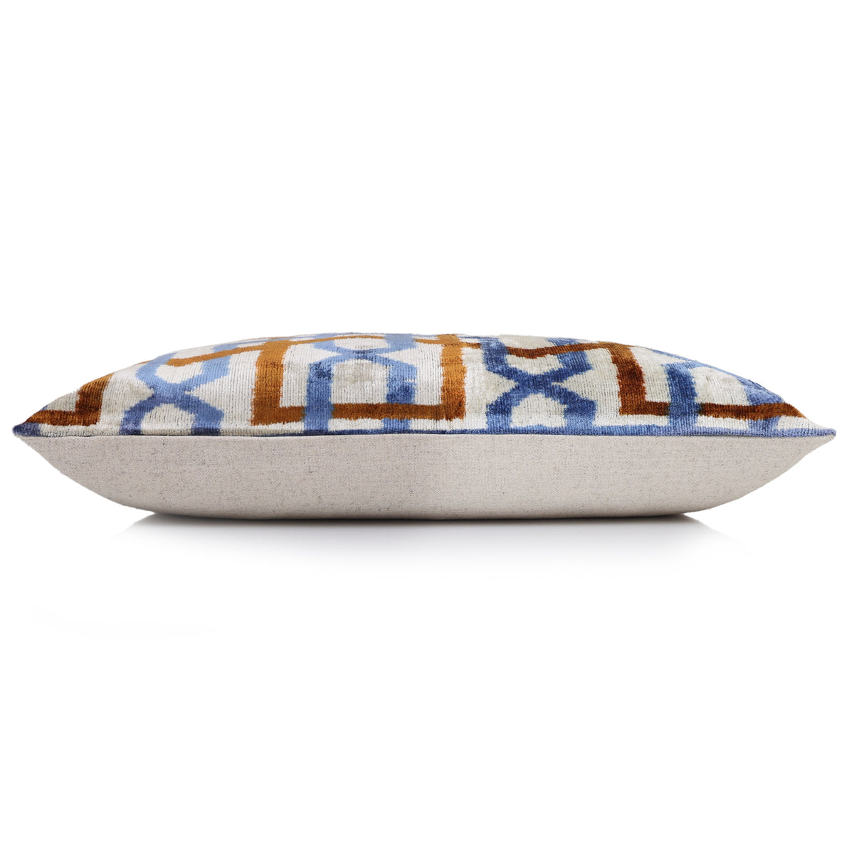 Side profile of the lumbar pillow showing depth and pale ivory backing