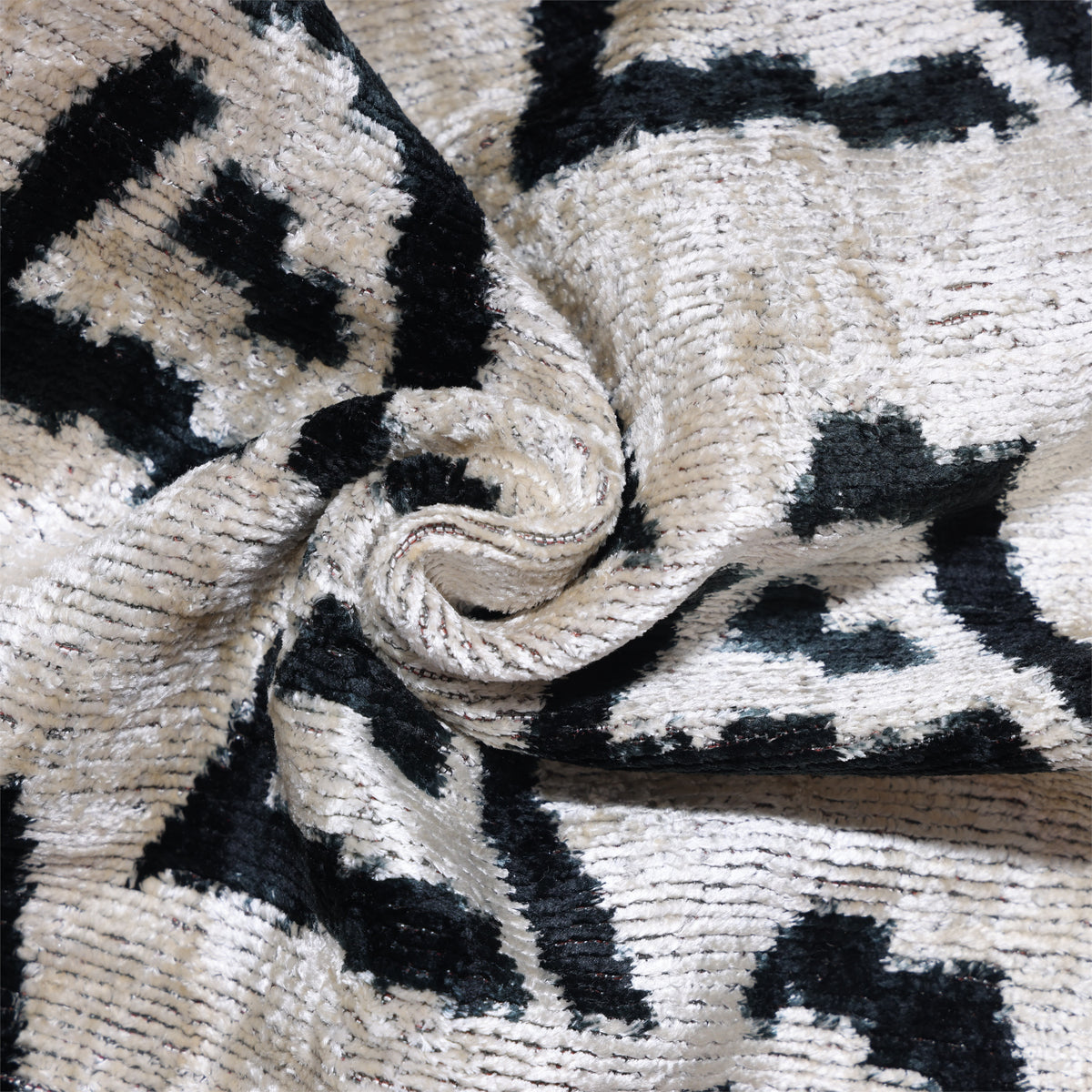 Close view of ivory and sand beige silk velvet with ribbed pile texture
