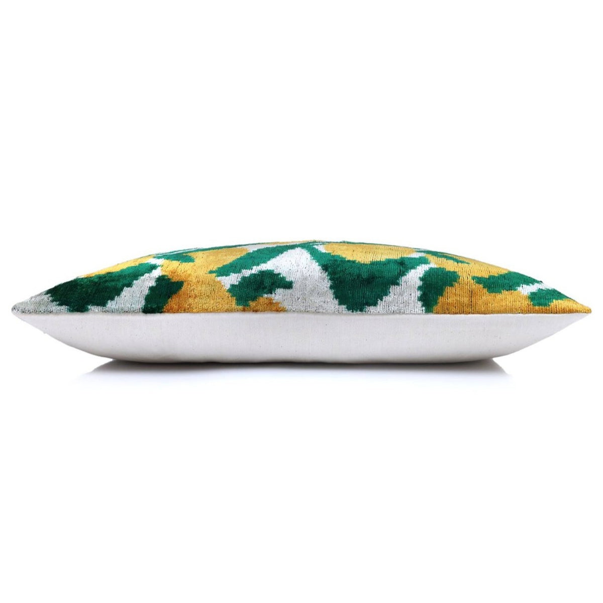 Side profile of rectangular pillow with patterned front and plain white back