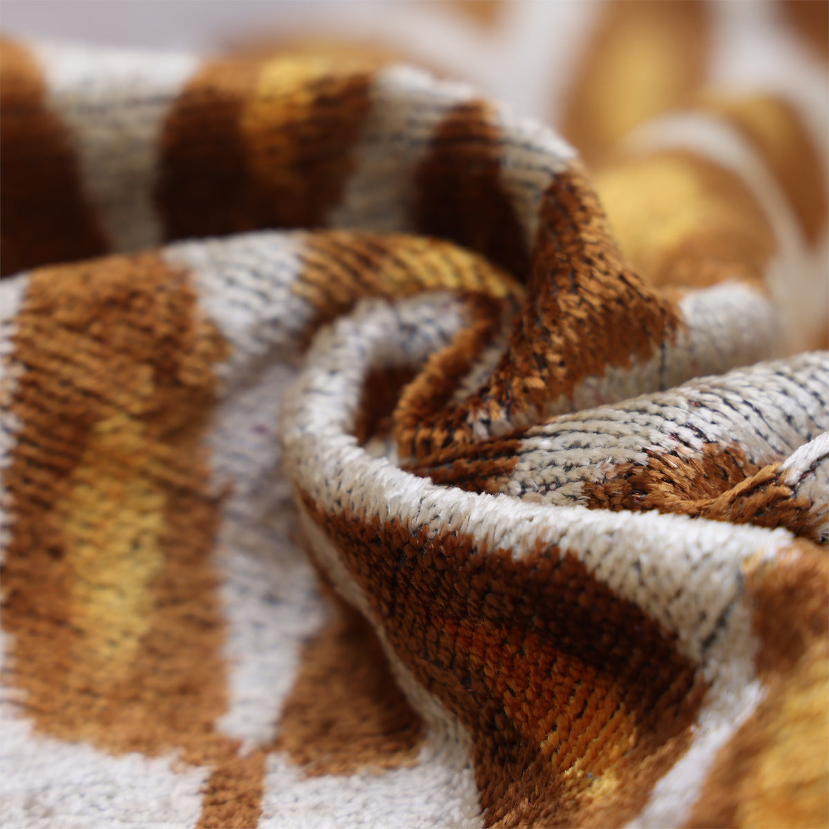 Macro view of silvery white velvet fold with luminous surface texture