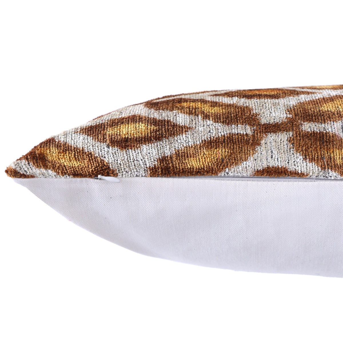 Detail of side seam and hidden zipper on geometric velvet pillow