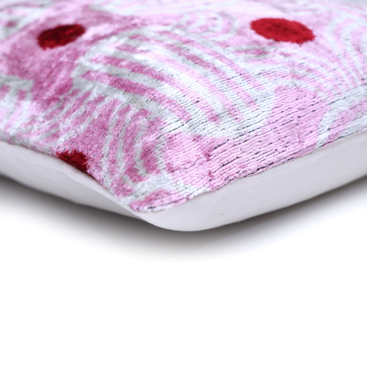 Corner detail showing lavender pink velvet edge, seam and soft white backing