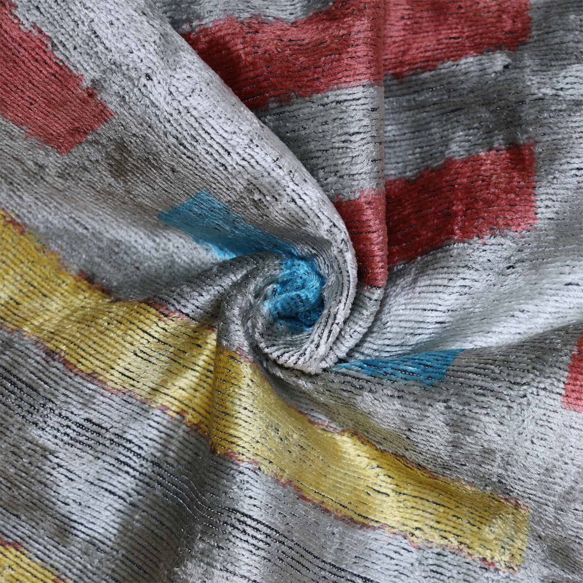 Close-up of ribbed silver gray silk velvet with a lustrous textured surface