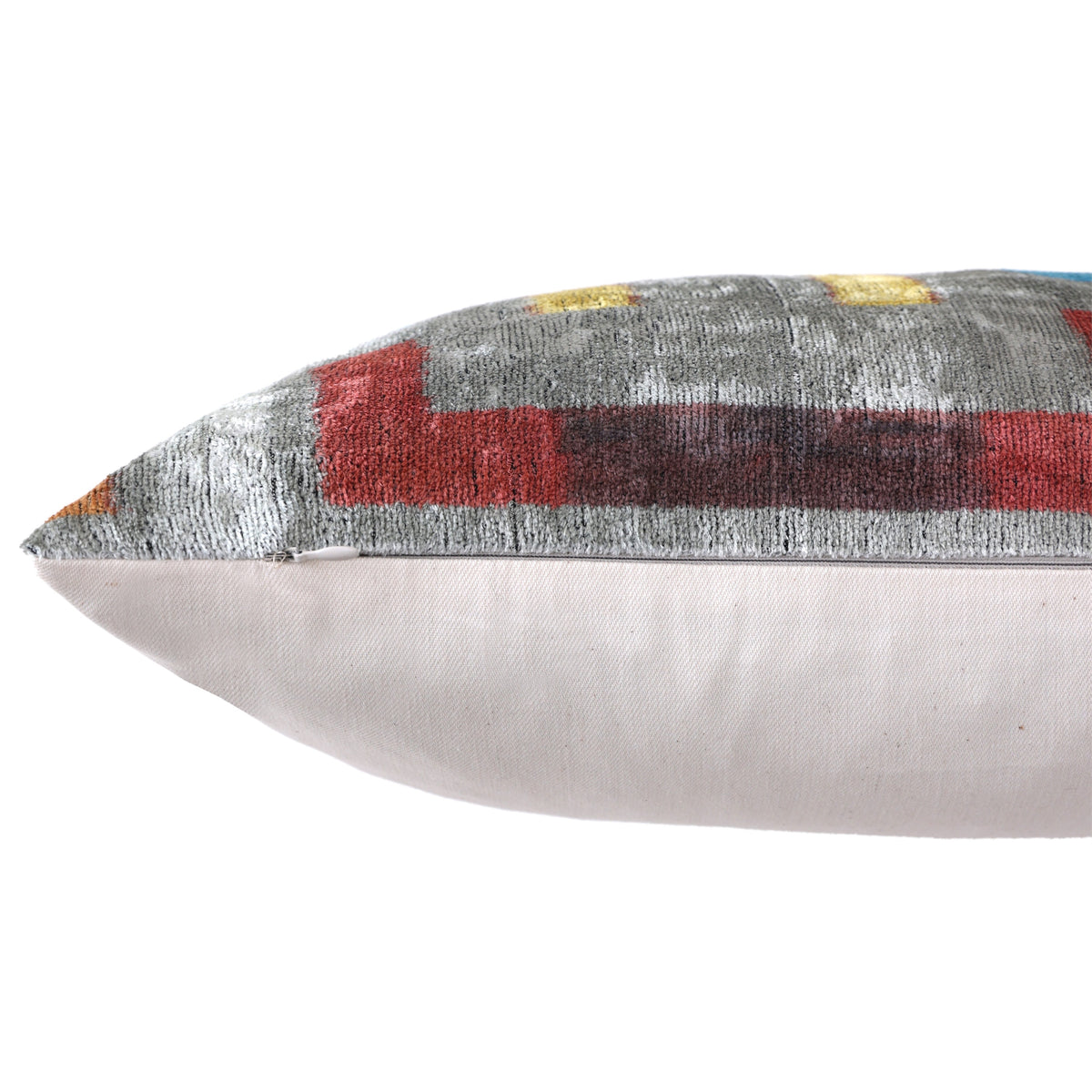 Hidden zipper running along the bottom edge of the silver gray lumbar pillow