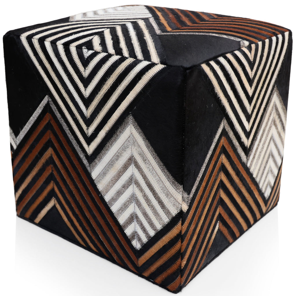 Cube-shaped ottoman with a geometric pattern on a white background